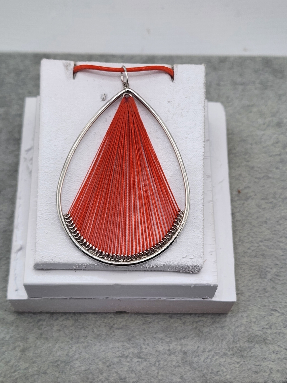 Silver Teardrop Necklace with Vibrant Orange Thread Accent